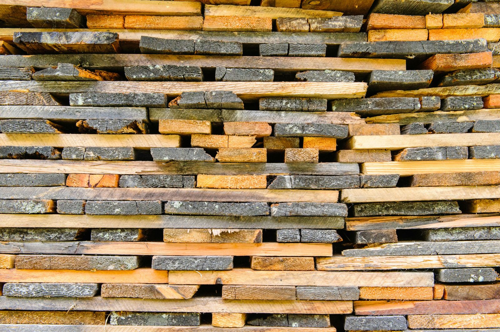 Lumber - Stacked lumber pile 2 by Alexander Schimmeck via Unsplash