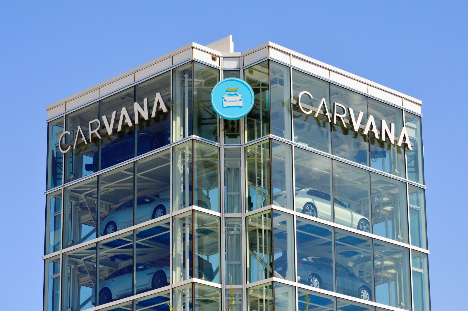 A close-up shot of a Carvana building by Around the World Photos via Shutterstock