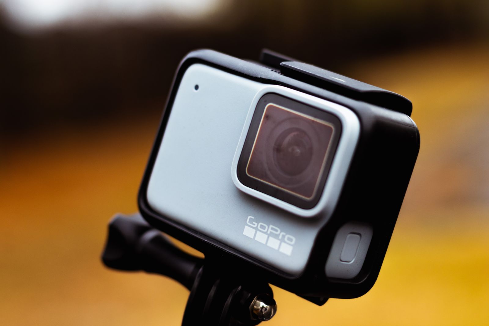 A close-up shot of a GoPro on an orange background by Larry George II via Shutterstock