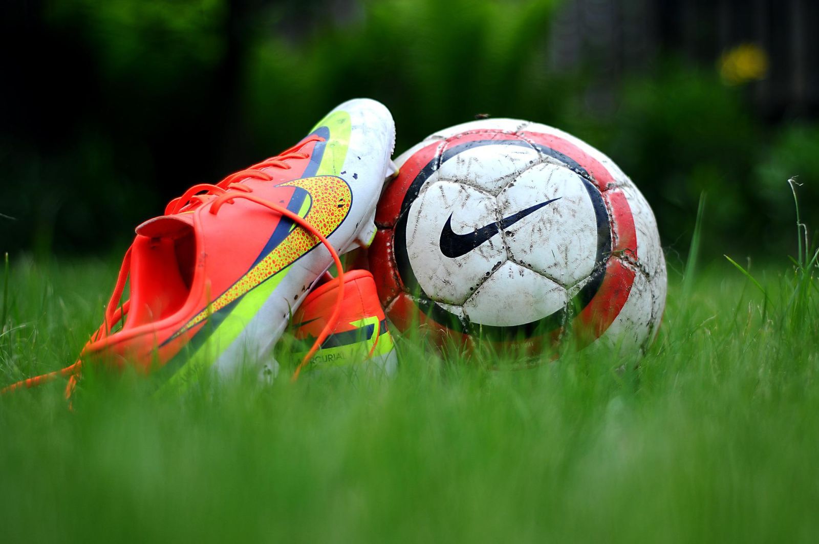 Consumer Products - Nike Cleats and Soccer Ball in Grass