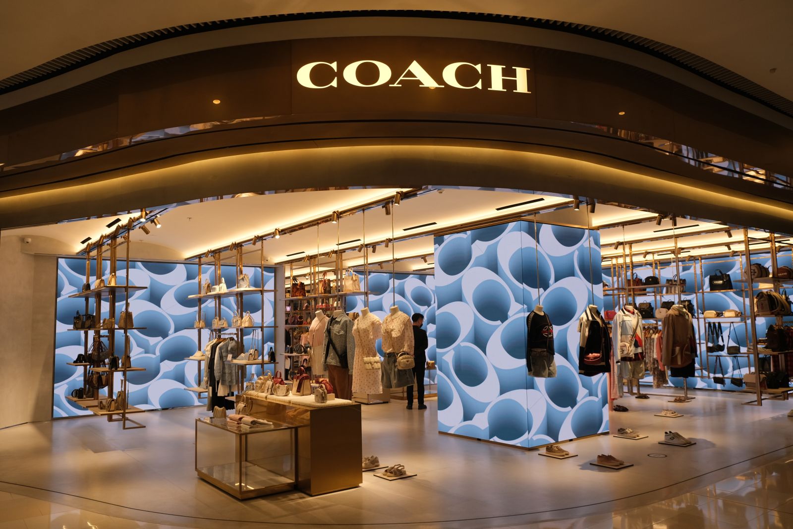 The front of a Coach store by Robert via Adobe Stock
