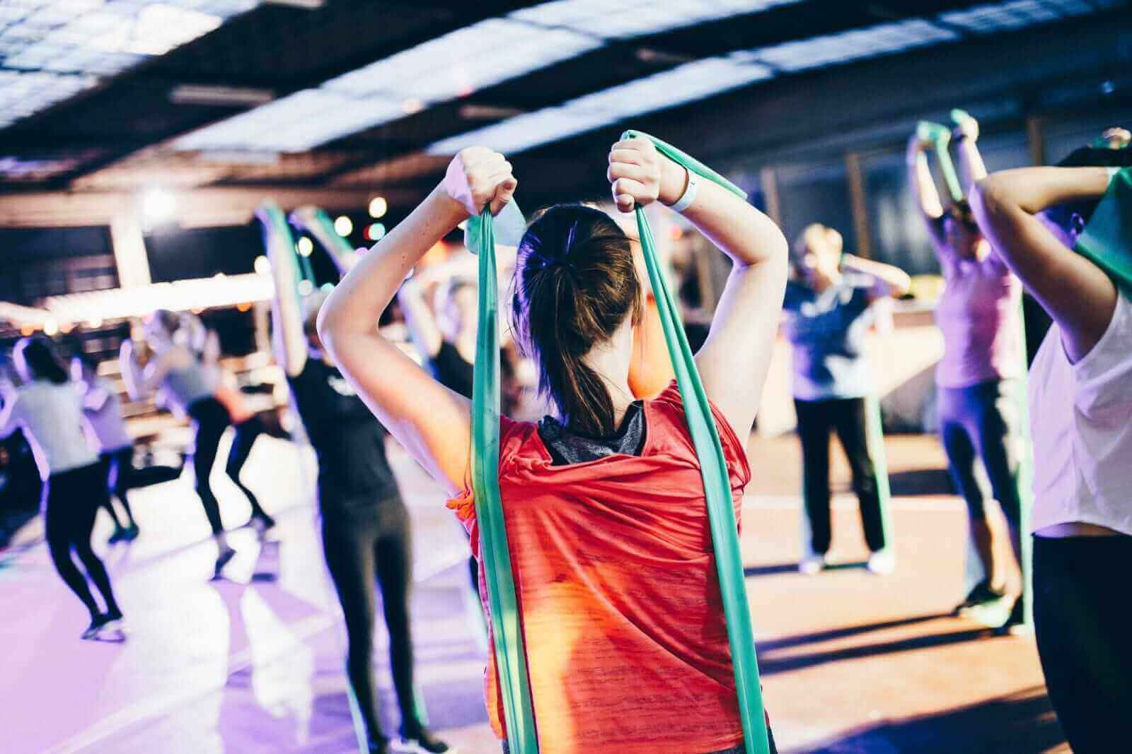 workout class with tension bands by Geert Pieters via Unsplash
