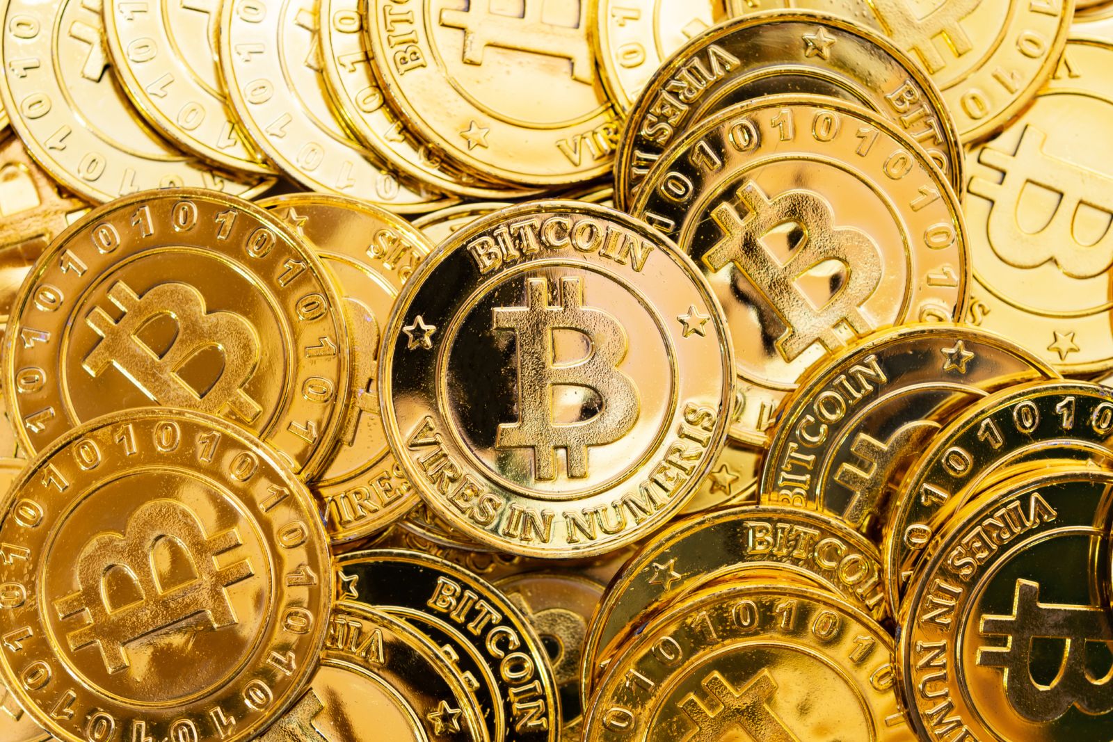 Many Bitcoin Gold Coins by Tevarak via iStock