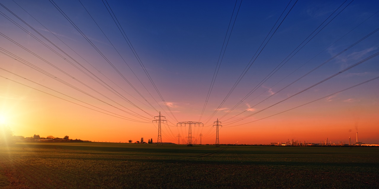 Electricity - electricity power lines at sunset by Jplenio via Pixabay
