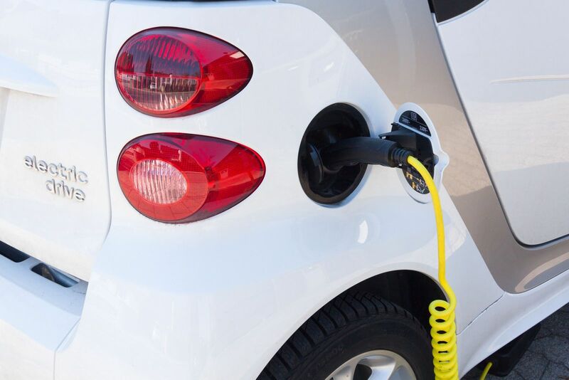 Green Energy (EV, solar, etc.) - Electric car being recharged