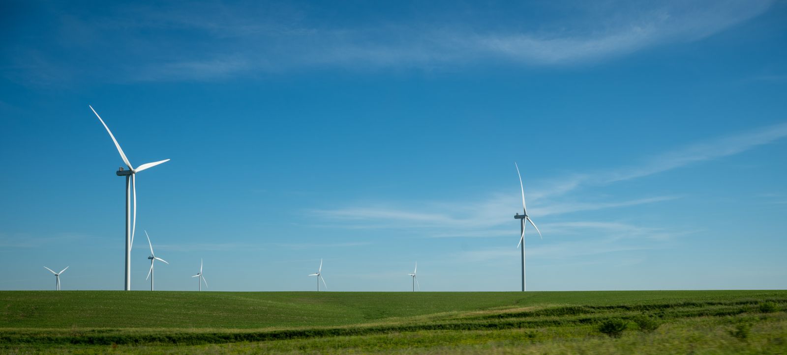 Green Energy (EV, solar, etc.) - Windmills on Sunny Day by WRS Photos via iStock