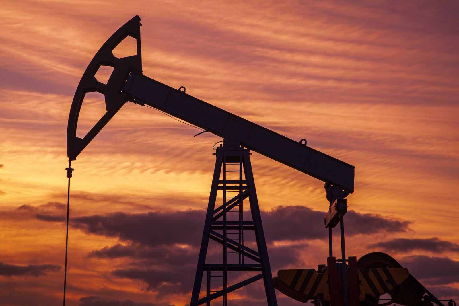 Oil - Oil jackpump at sunset 2 by Evgenii Mitroshin via iStock