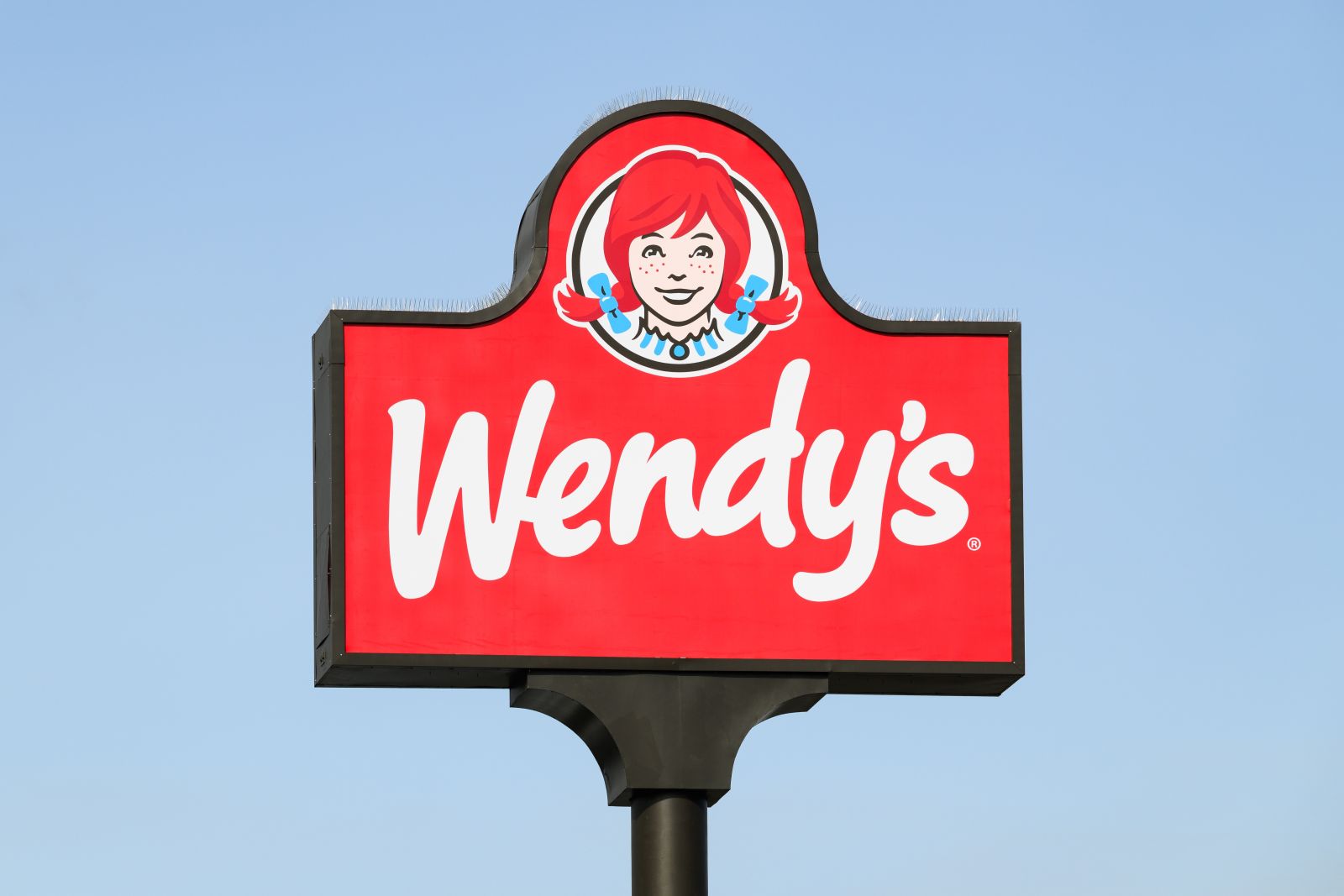 A close up of the Wendy's sign by Ian Dewar Photography via Shutterstock