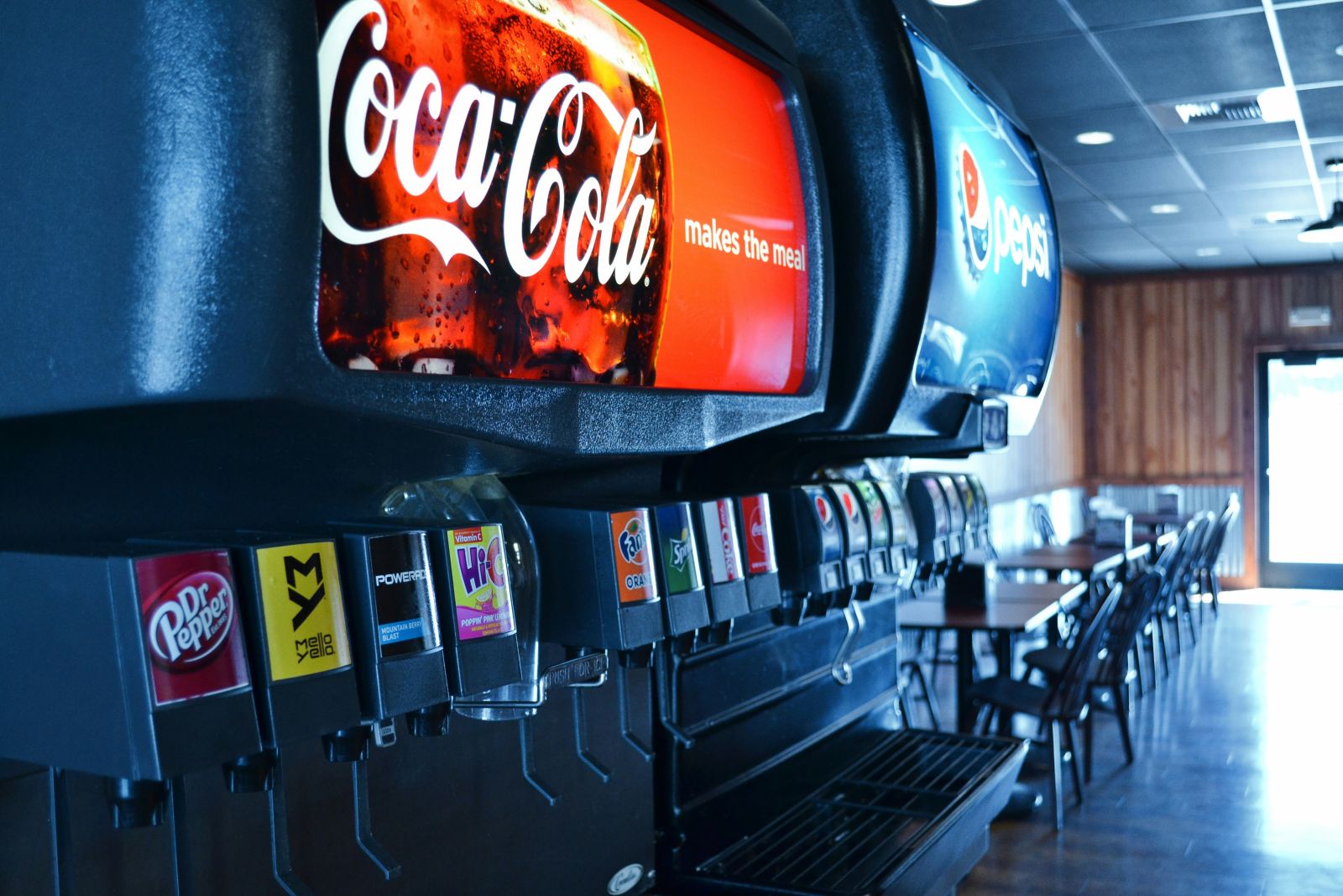 Food, Bev & Cannabis - Coca Cola beverage dispenser by Troy Coroles via Unsplash