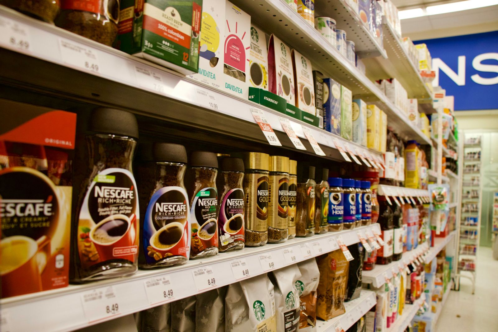 Food, Bev & Cannabis - Coffee isle in a grocery store by Charles Gao via Unsplash