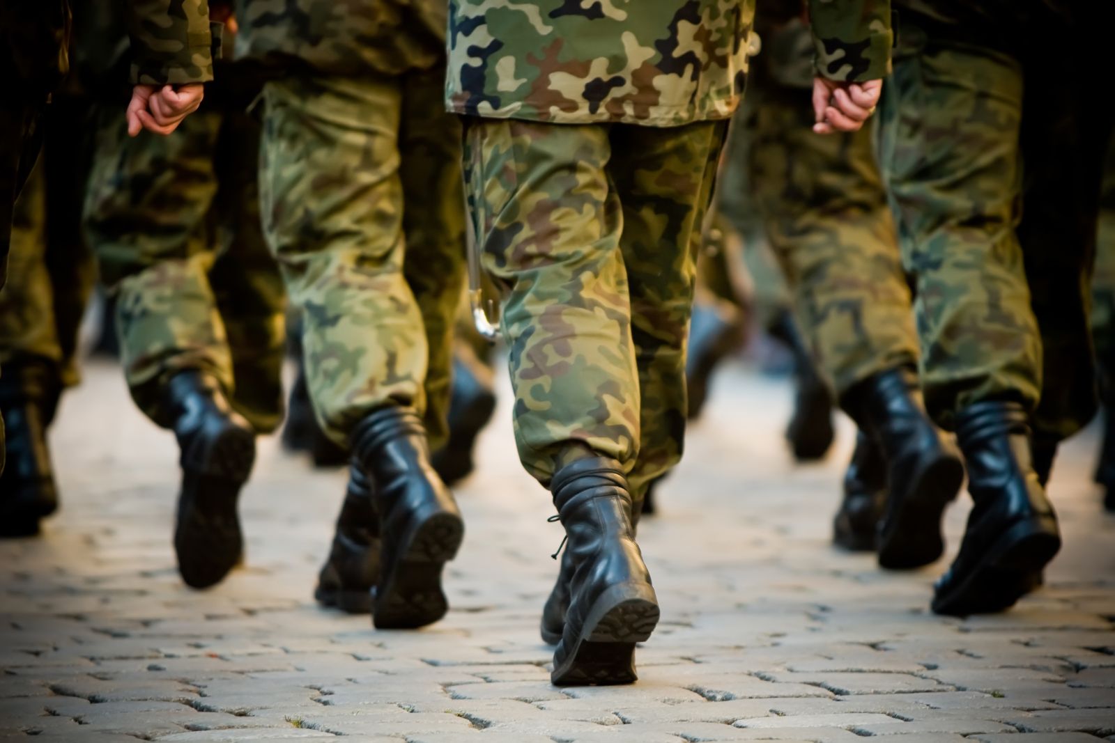 Soldiers marching via Shutterstock