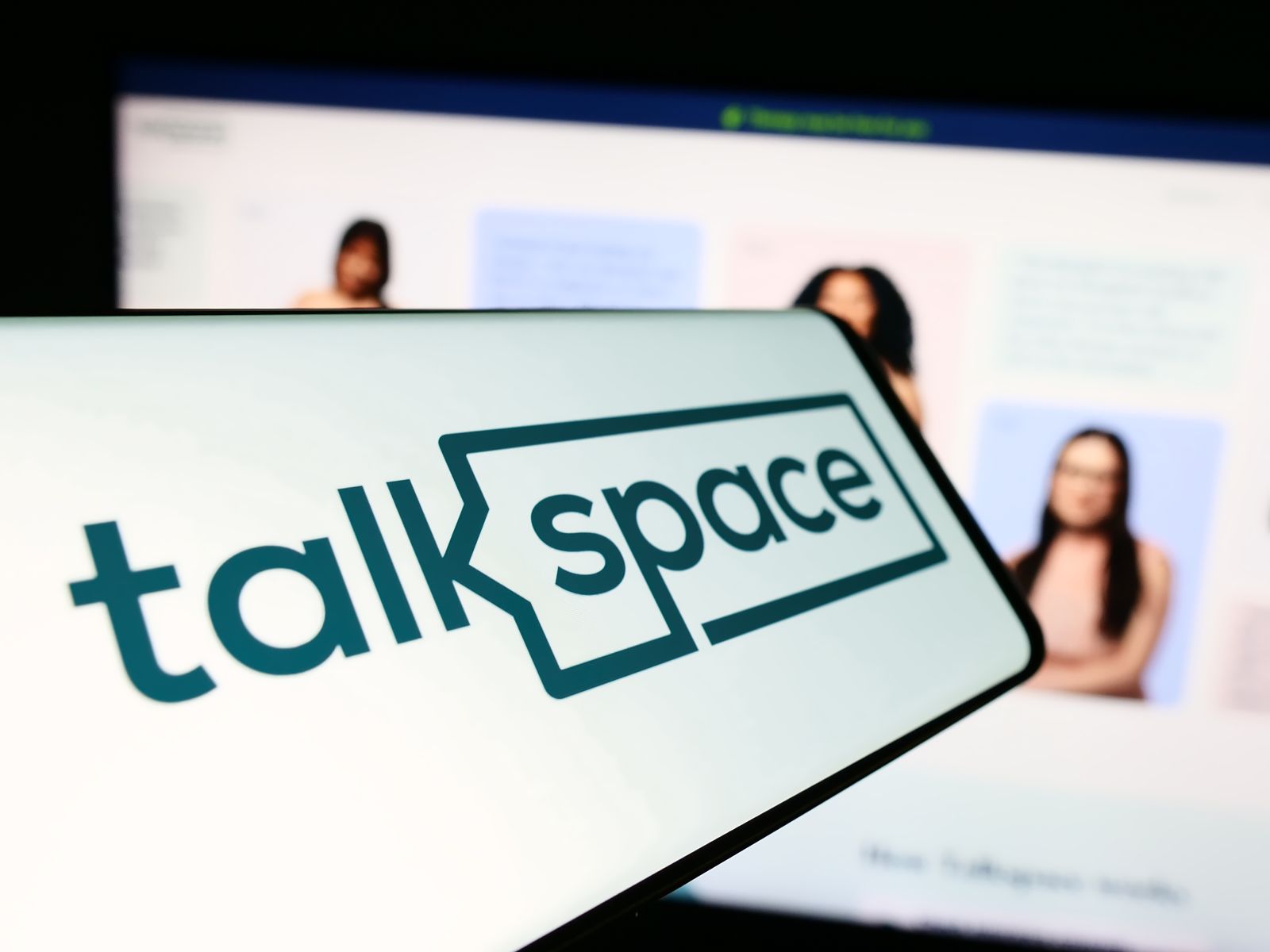 A close-up of the Talkspace logo on a smartphone by Timon via Adobe Stock