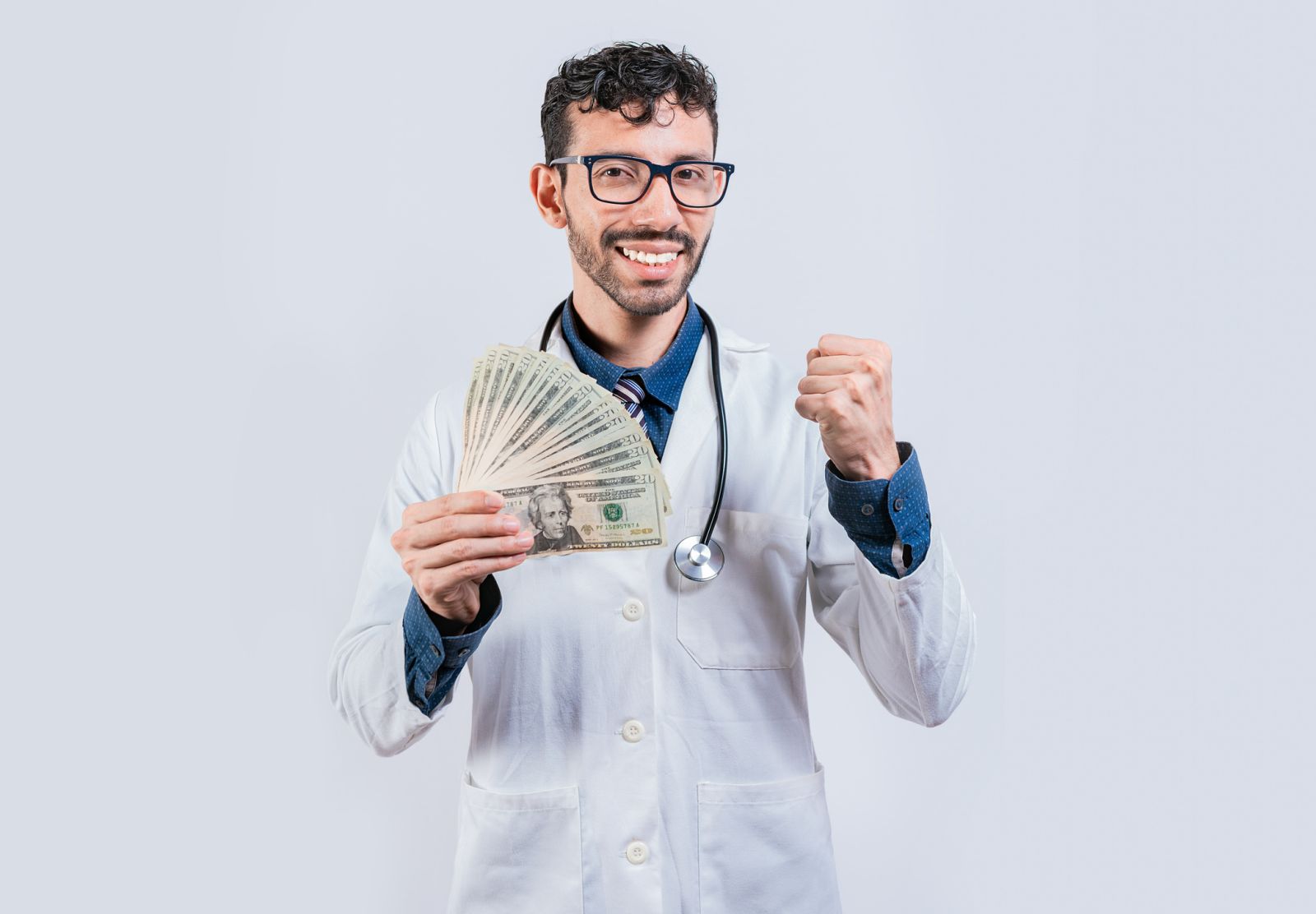 Healthcare - Doctor holding money by IherPhoto via iStock