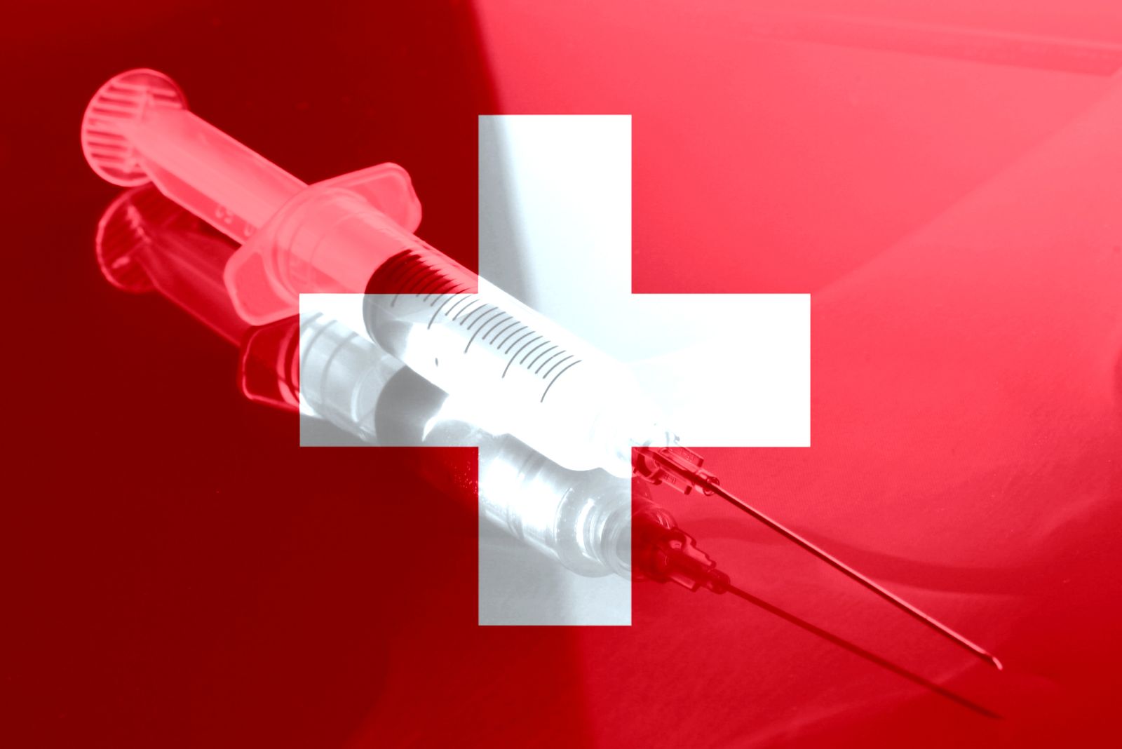 Healthcare - Syringe and red cross by Stadratte via iStock