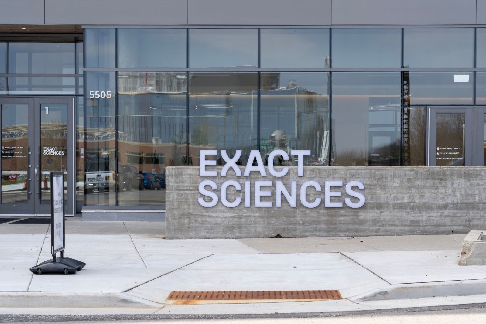 The Exact Sciences logo on an office building by JHVEPhoto via Shutterstock