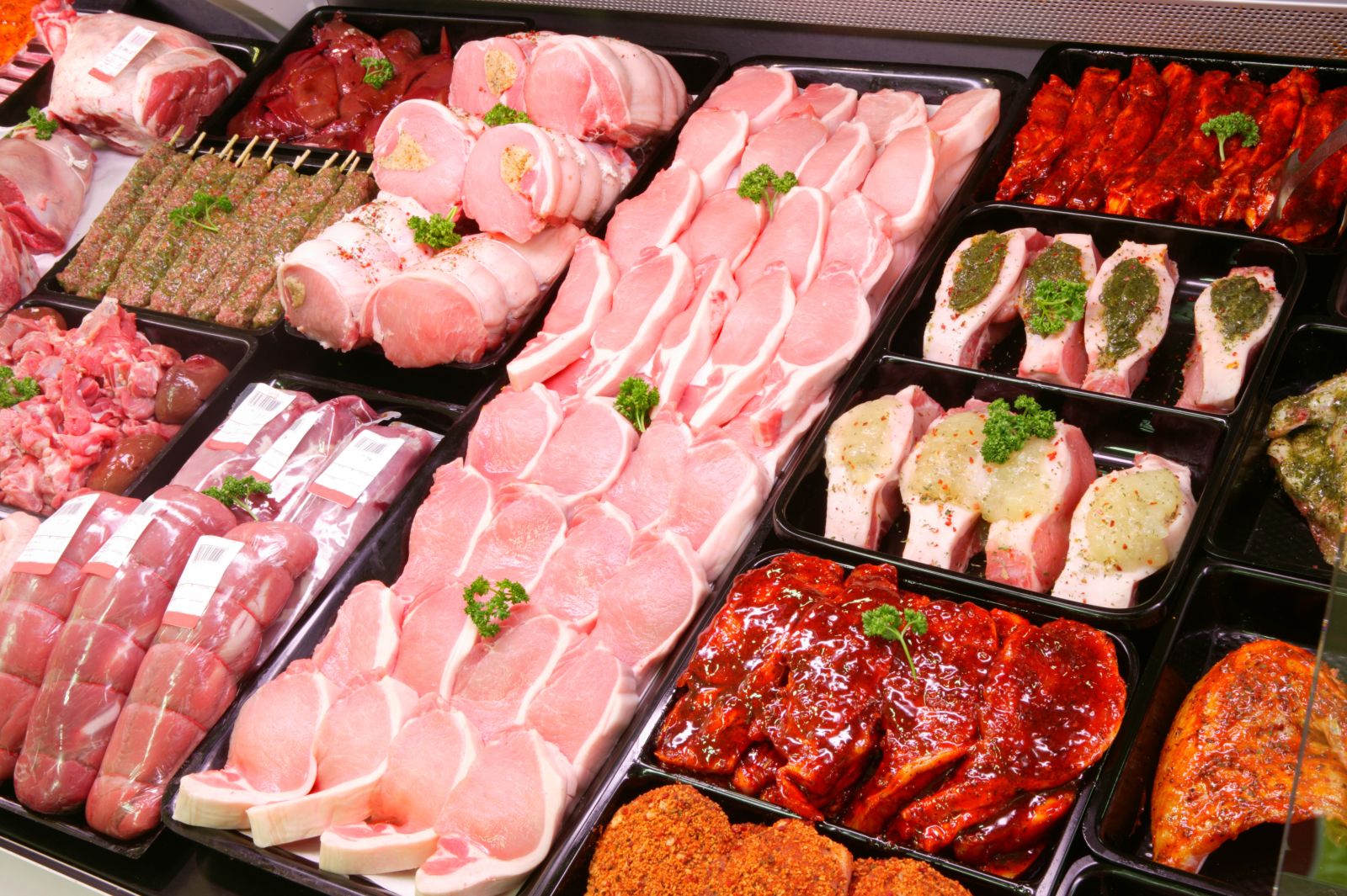 A selection of pork on display in a butchers shop by camij via iStock