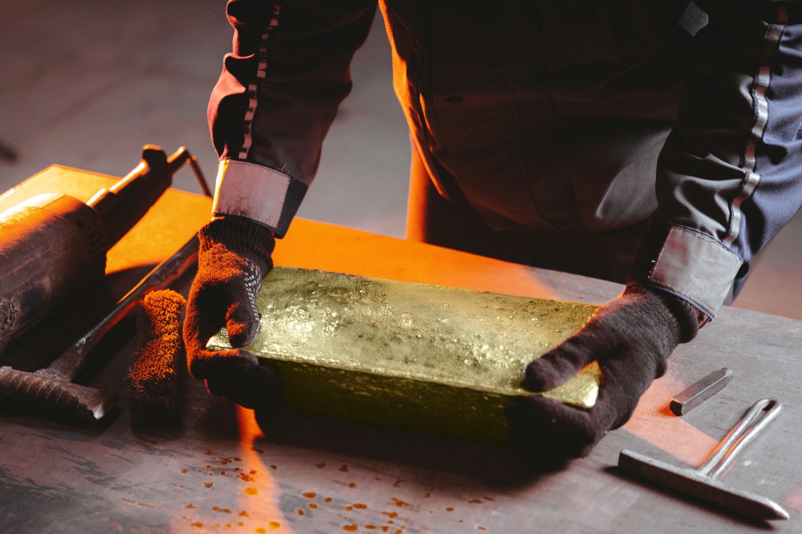 Gold - Creating gold bullion by Mark Agnor via Shutterstock