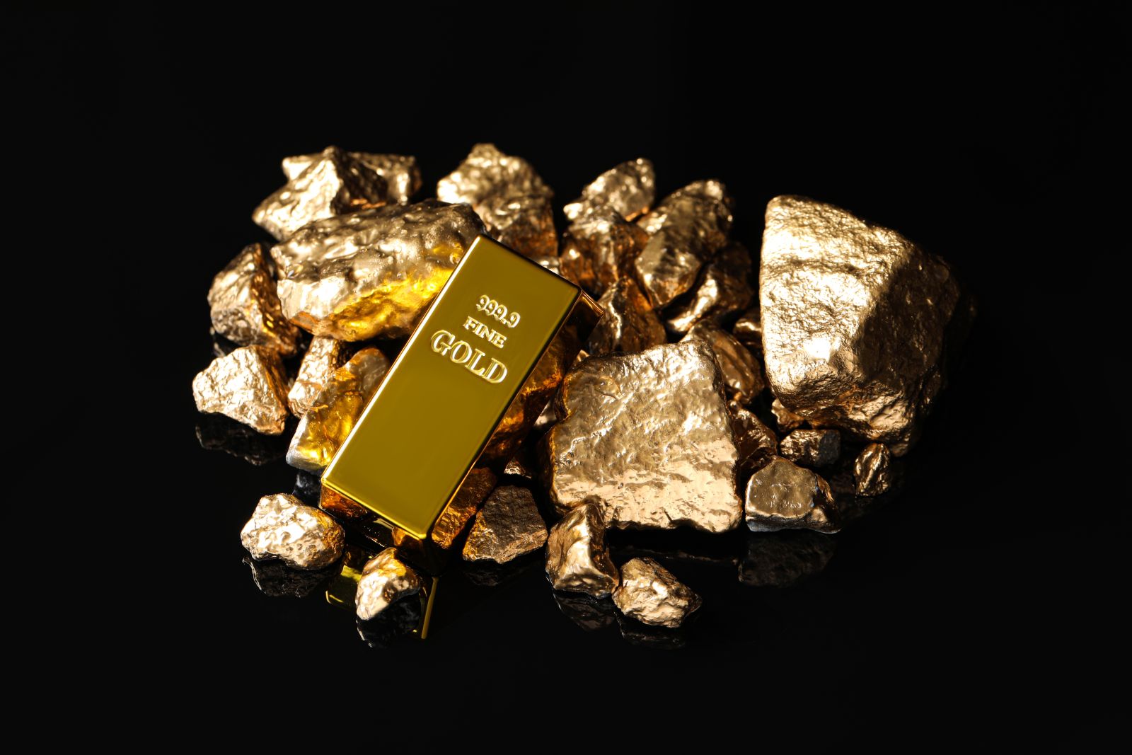 Gold - Gold ingot and nuggets by New Africa via Shutterstock