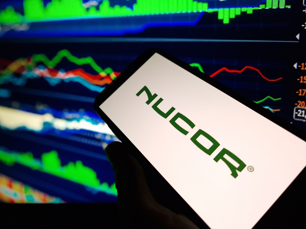 Basic Materials - Nucor Corp_ phone and chart -by Piotr Swat via Shutterstock