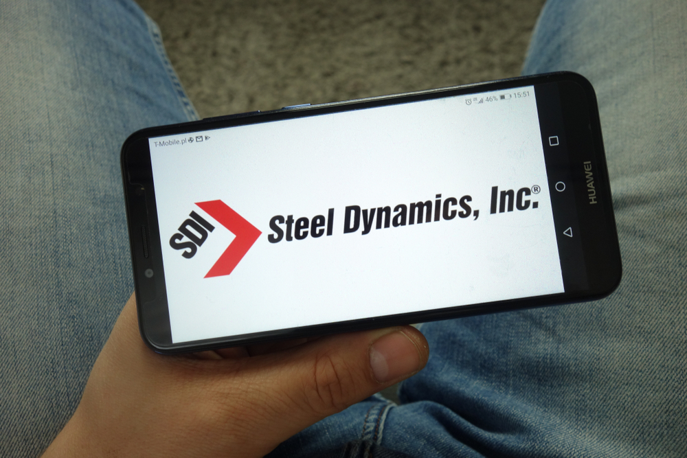 Basic Materials - Steel Dynamics Inc_  hand holding phone -by Piotr Swat via Shutterstock