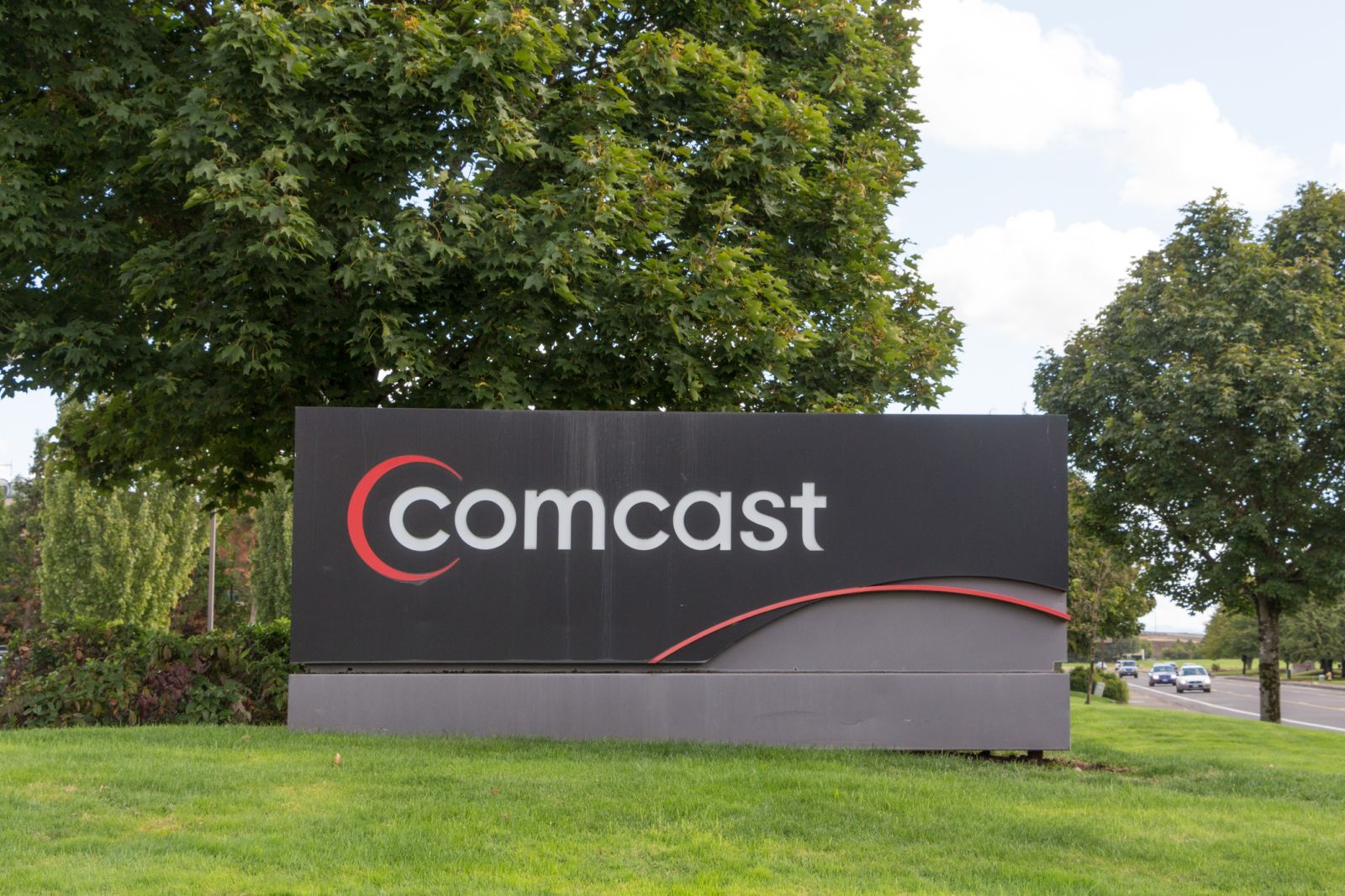 Communication Services - Comcast Corp sign by- SweetBabeeJay via iStock