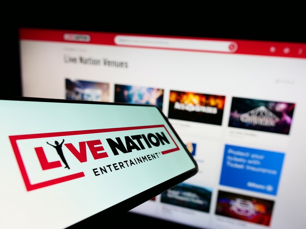 Communication Services - Live Nation Entertainment Inc phone and laptop by- T_Schneider via Shutterstock