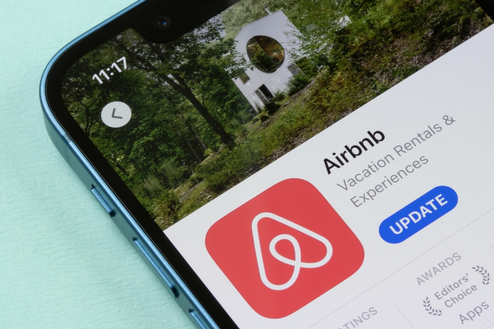 Consumer Cyclical (names A - H) - Airbnb Inc phone app by - Tada Images via Shutterstock