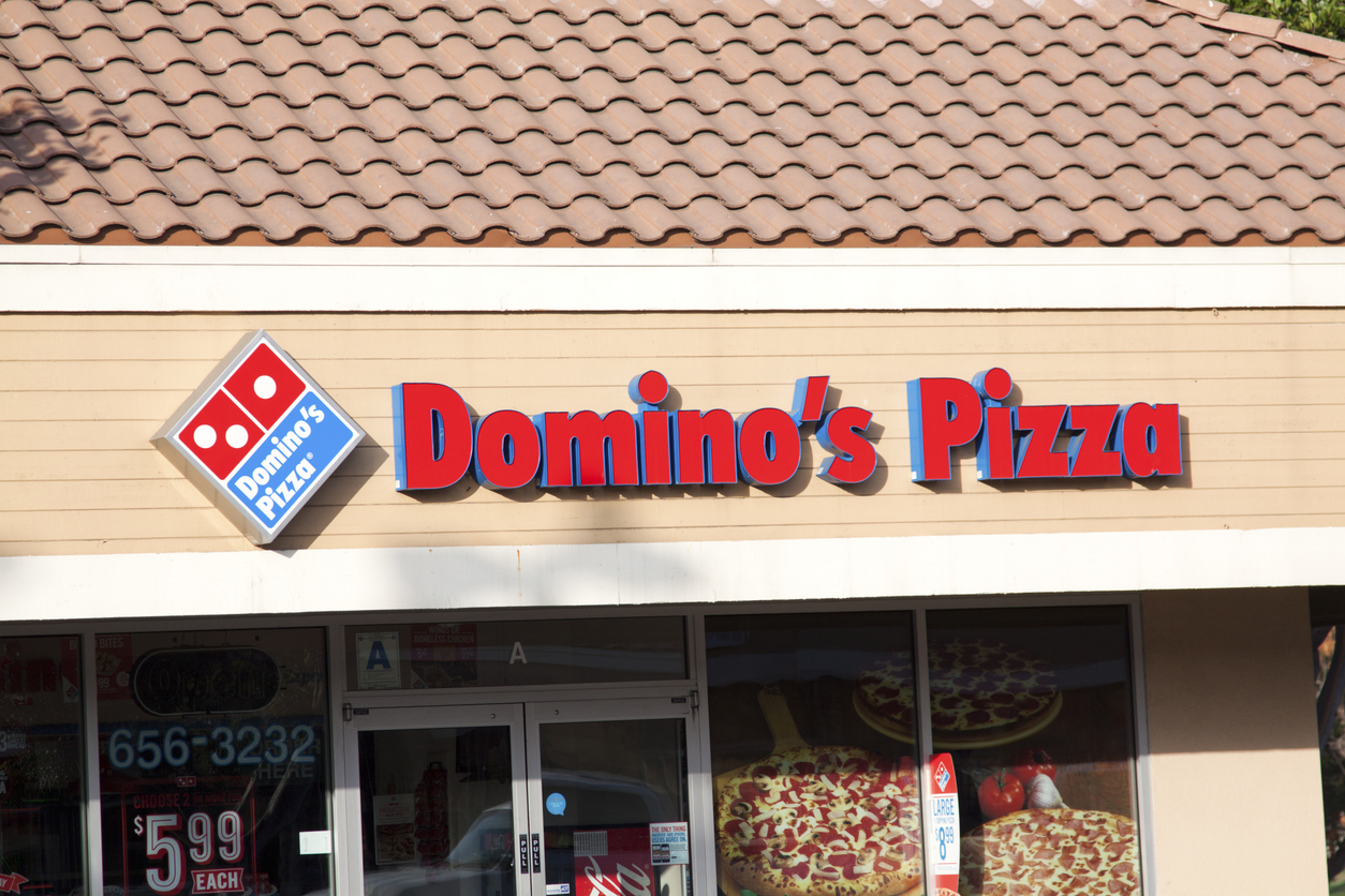 Consumer Cyclical (names A - H) - Dominos Pizza Inc storefront by-KathyDewar via iStock