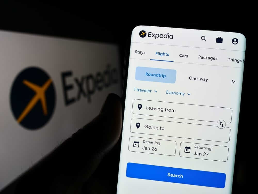 Expedia Group Inc  app and logo by- T Schneider via Shutterstock