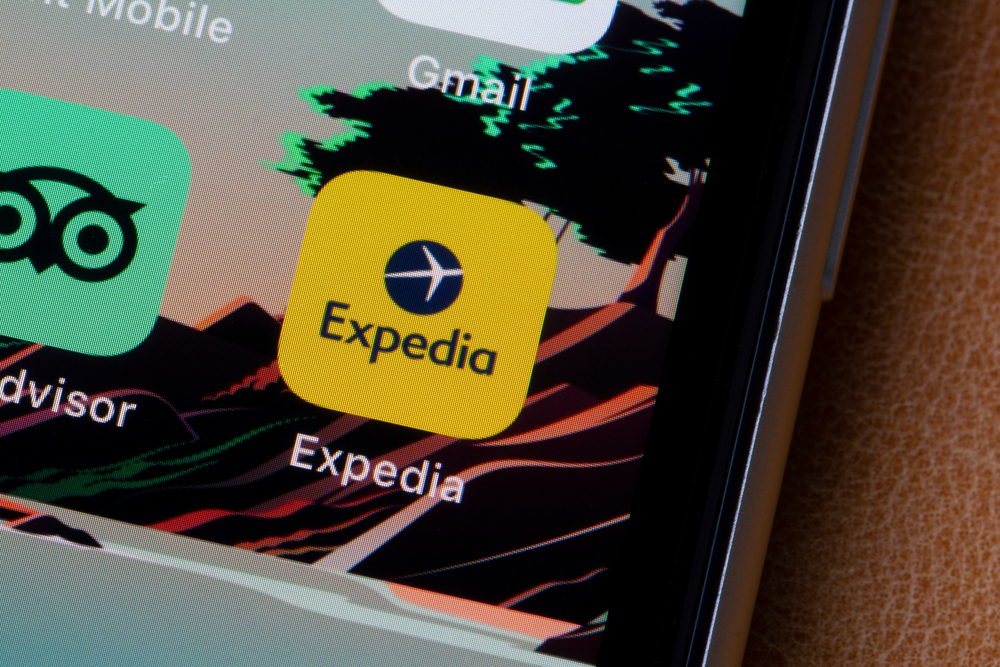 Consumer Cyclical (names A - H) - Expedia Group Inc phone app by- Tada Images via Shutterstock