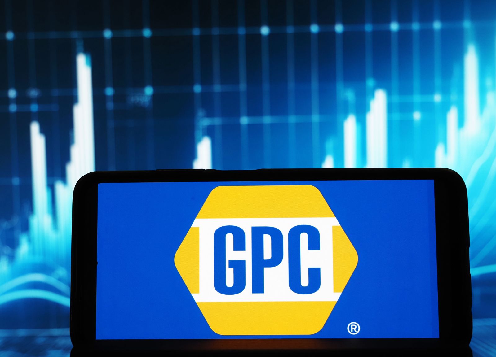 Genuine Parts Company logo seen displayed on a smartphone_ By Игорь Головнёв
