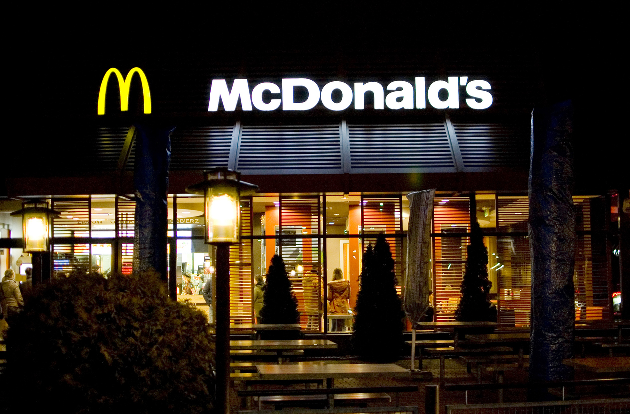 Consumer Cyclical (names I - Z) - McDonald's Corp store at night by- Magdalena Wygralak via iStock