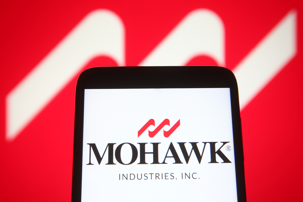 Consumer Cyclical (names I - Z) - Mohawk Industries, Inc_ logo on phone by- viewimage via Shutterstock