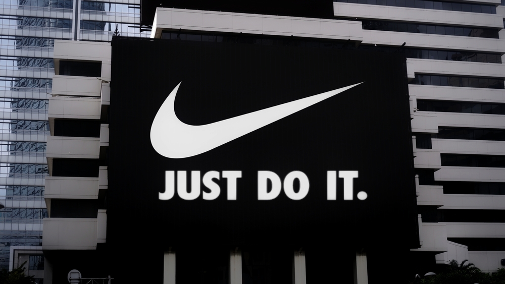 Consumer Cyclical (names I - Z) - Nike, Inc_ logo by- Poetra_RH via Shutterstock