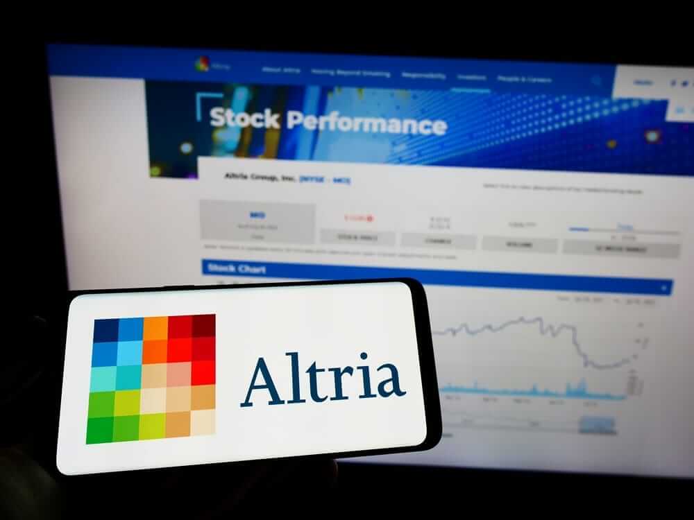 Altria Group Inc_ logo and stock background- by T_Schneider via Shutterstock