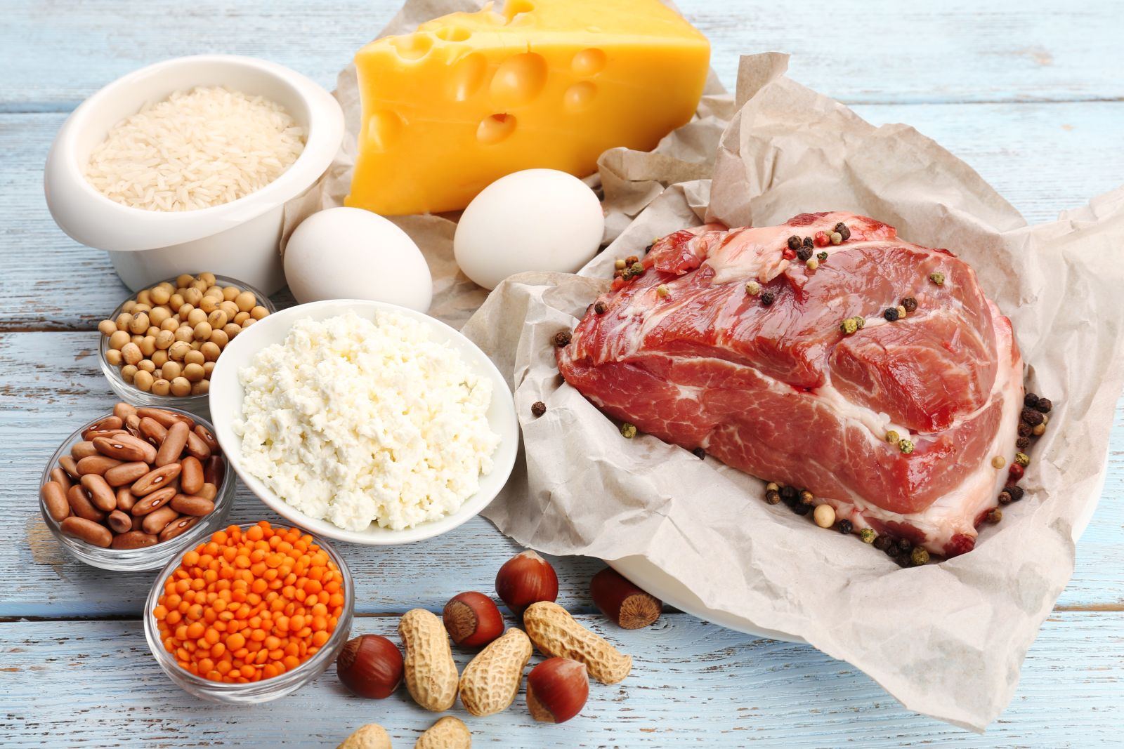 Food high in protein meat fish dairy eggs on table by Africa Studio via Adobe Stock