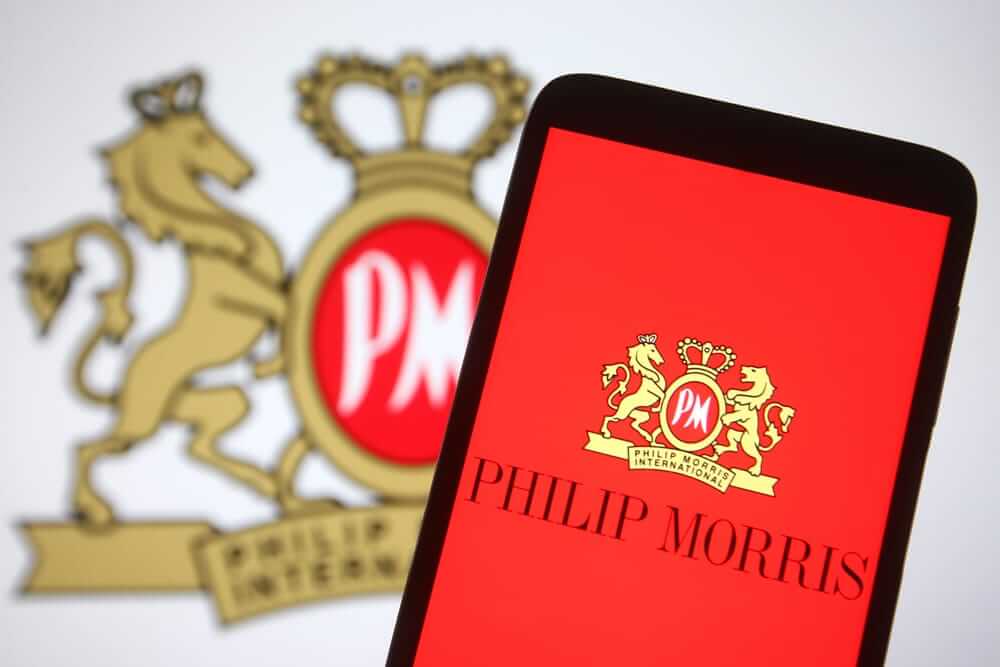 Philip Morris International Inc logo on phone - by viewimage via Shutterstock