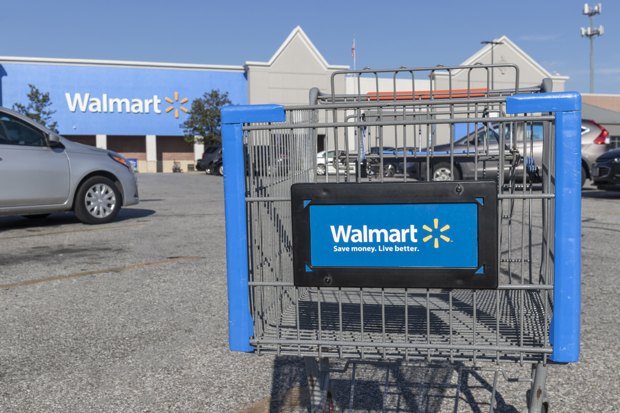 Consumer Defensive - Walmart Inc cart in lot -by jetcityimage via iStock