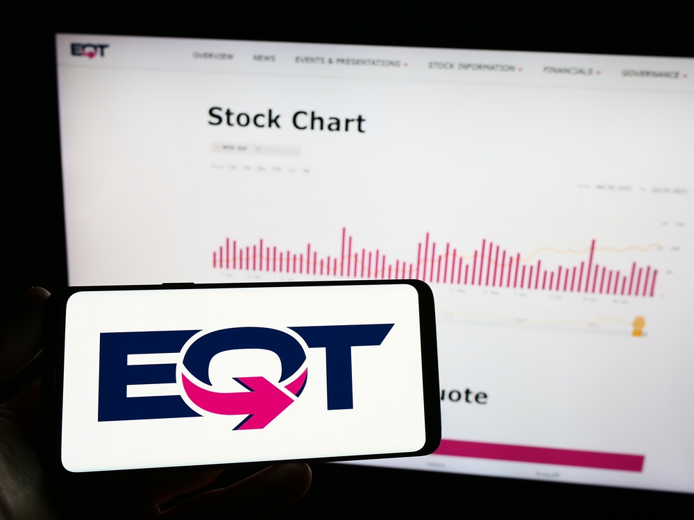 Energy - EQT Corp logo and stock chart- by T_Schneider via Shutterstock