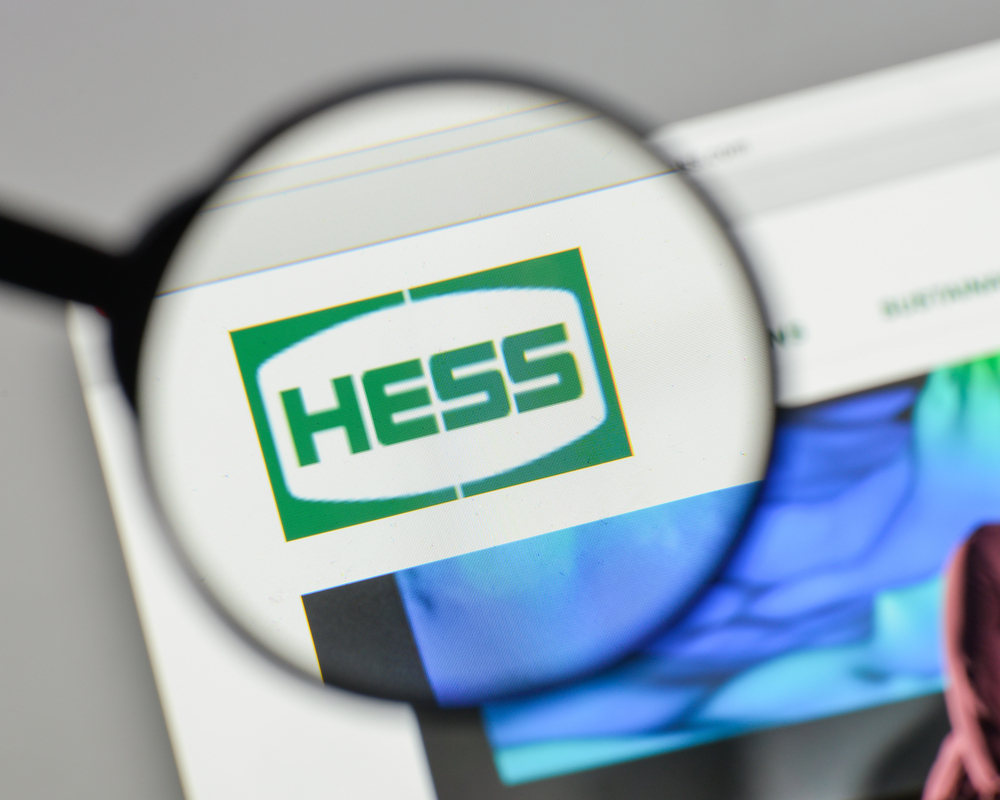 Energy - Hess Corporation magnified logo- by Casimiro PT via Shutterstock