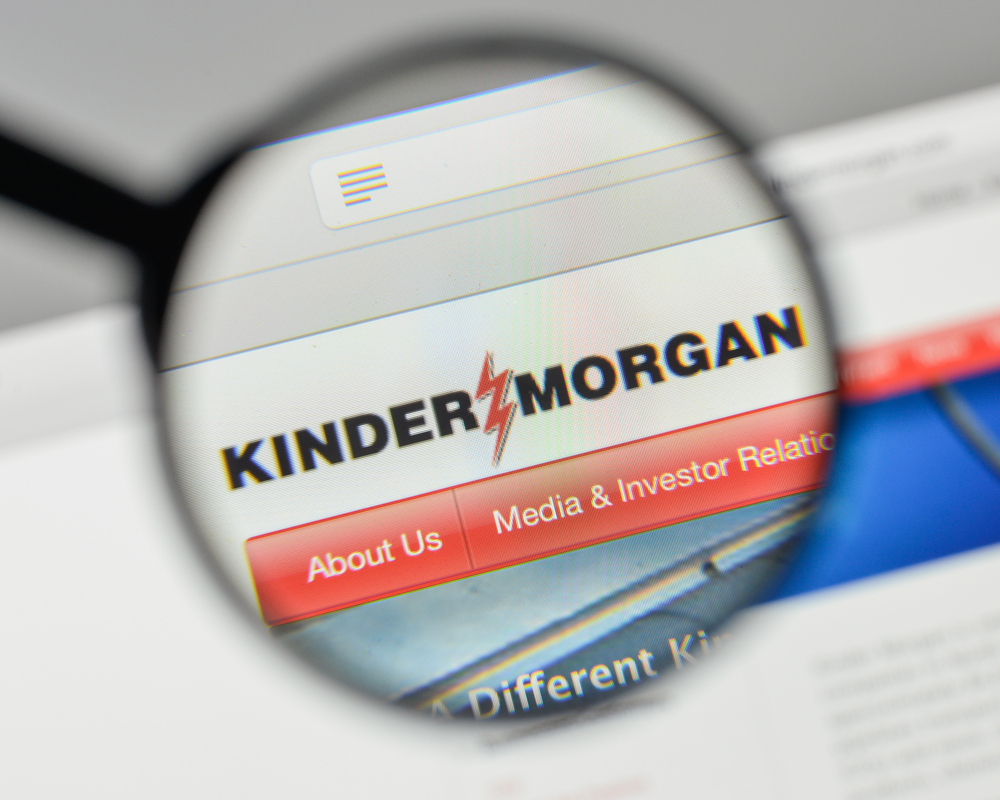 Energy - Kinder Morgan Inc magnified logo-by Casimiro PT via Shutterstock
