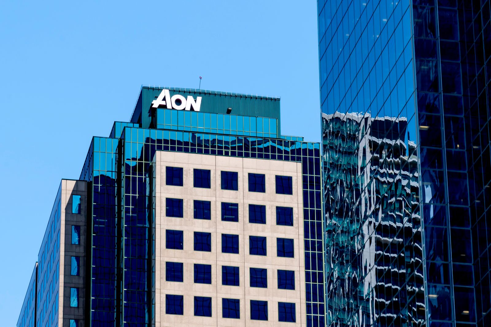 Aon sign on the head office building in Toronto, Canada_ By JHVEPhoto