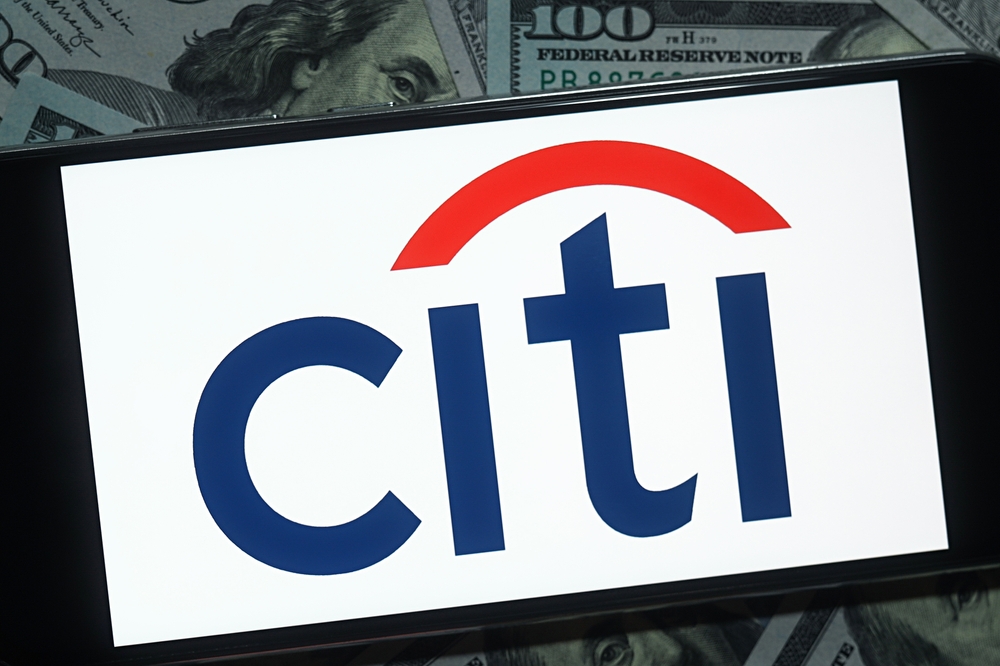 Citigroup Inc logo and money background-by photo_gonzo via Shutterstock