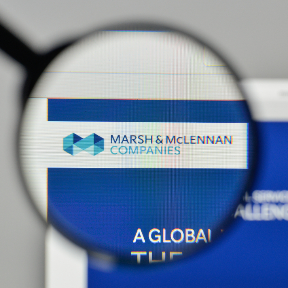 Financial (names J - Z) - Marsh & McLennan Cos_, Inc_ magnified logo by- Casimiro PT via Shutterstock