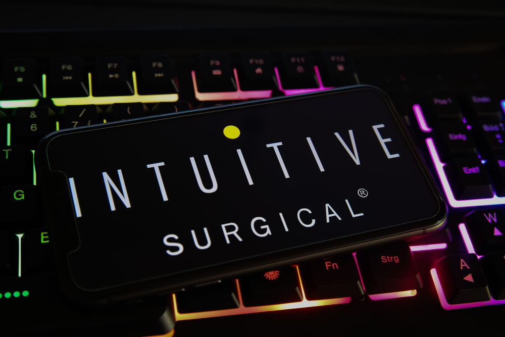 Healthcare (names I - Z) - Intuitive Surgical Inc logo on phone-by Ralf Liebhold via Shutterstock