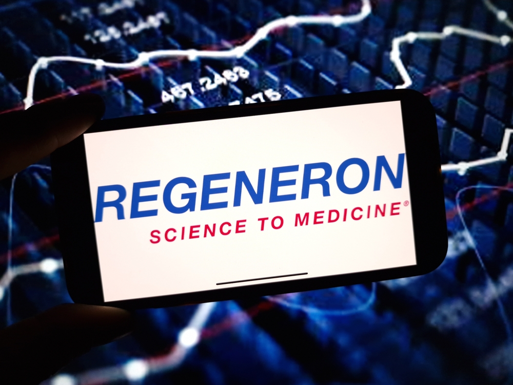 Healthcare (names I - Z) - Regeneron Pharmaceuticals, Inc_ logo on phone-by Piotr Swat via Shutterstock