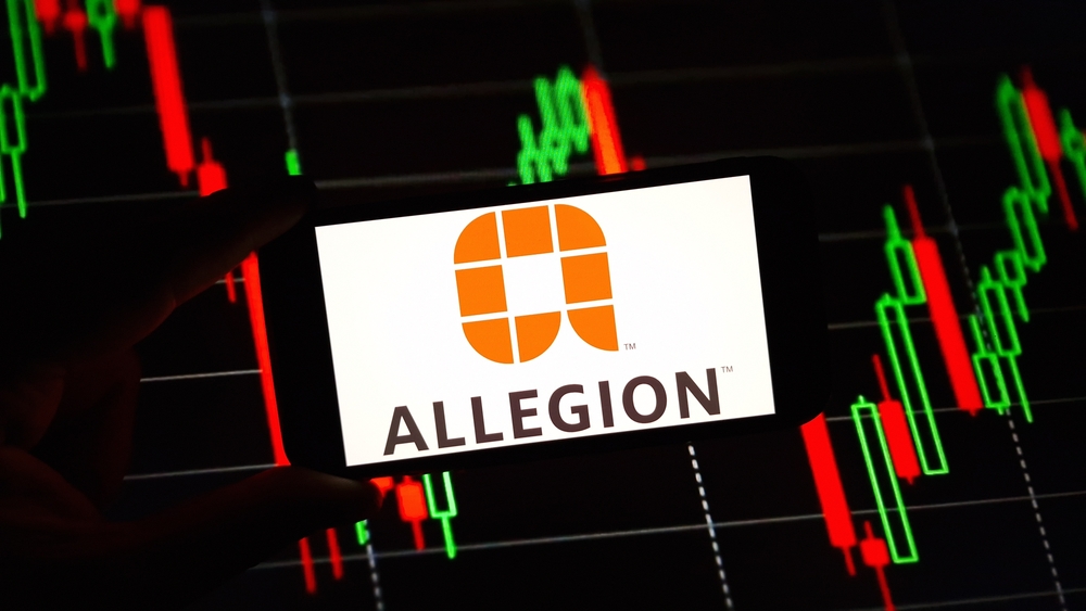 Industrials (names A - I) - Allegion plc chart and logo on phone-by Piotr Swat via Shutterstock