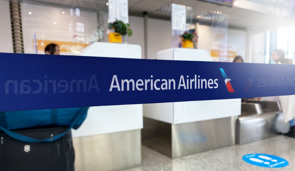 Industrials (names A - I) - American Airlines Group Inc logo in airport-by rarrarorro via Shutterstock