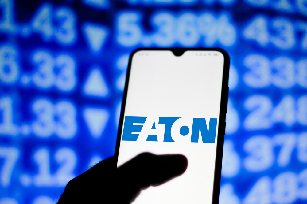 Industrials (names A - I) - Eaton Corporation plc logo on phone-by rafapress via Shutterstock