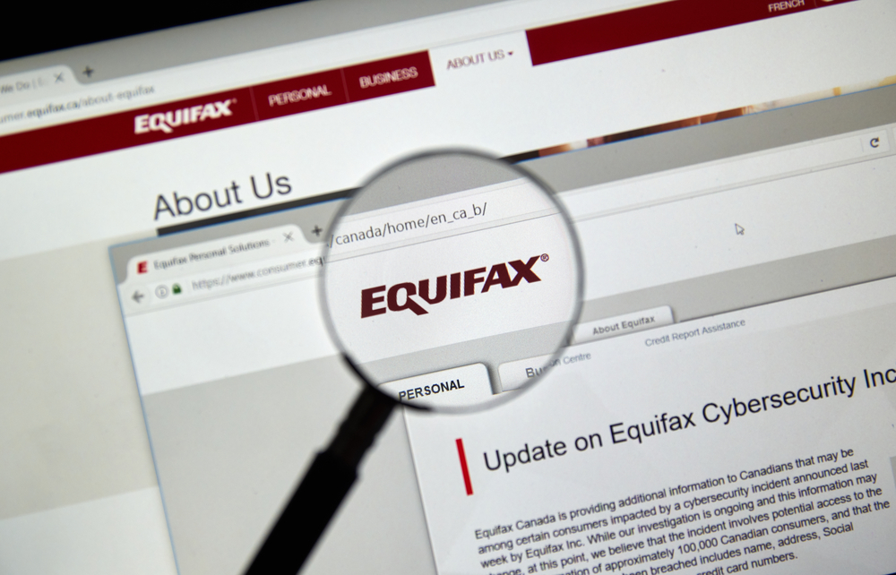 Industrials (names A - I) - Equifax, Inc_ logo magnified-by dennizn via Shutterstock